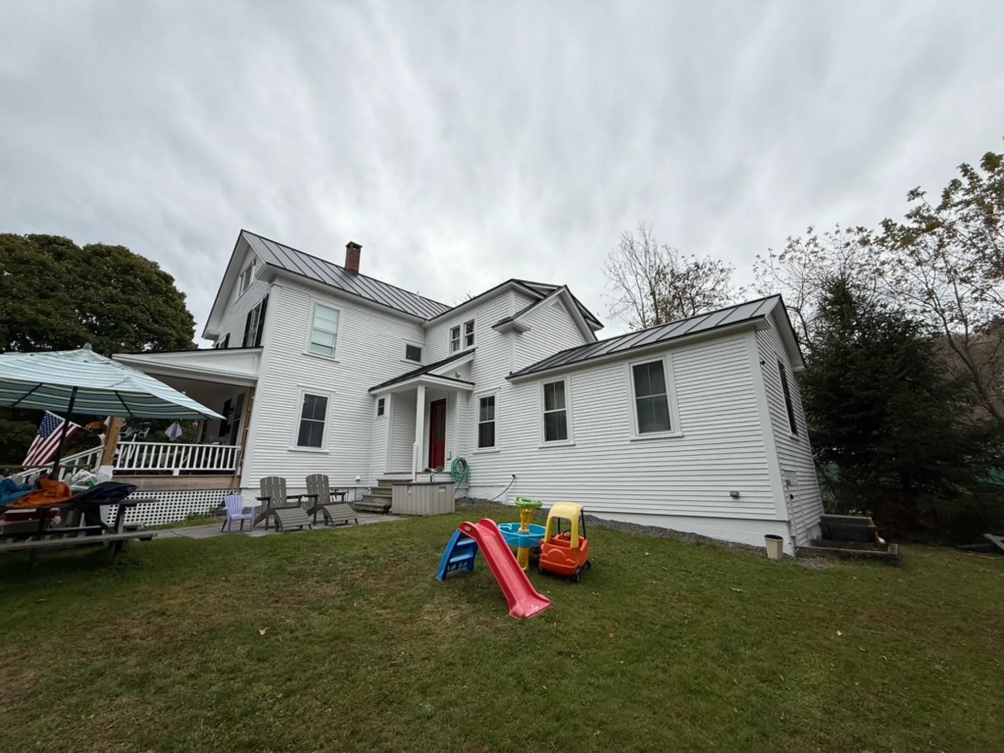 house painter working on siding